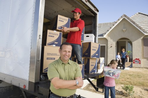 Man and van team handling boxes and household items in Hornchurch