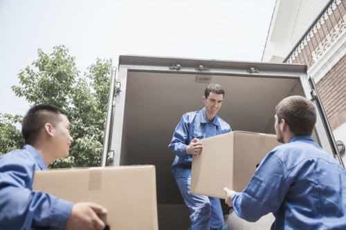 Packed moving boxes and furniture ready for Hornchurch relocation