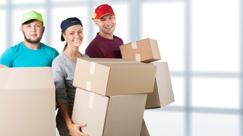 Professional movers unloading belongings at a Hornchurch property