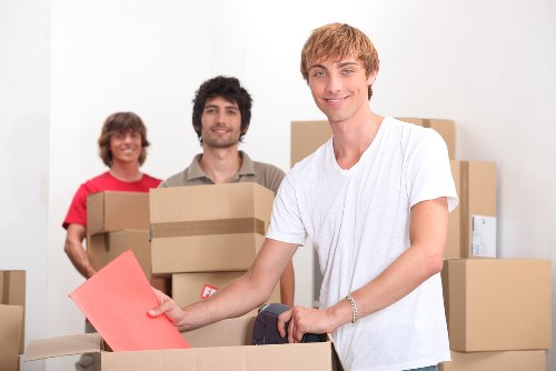 Furniture and household items being unloaded at a new Hornchurch home