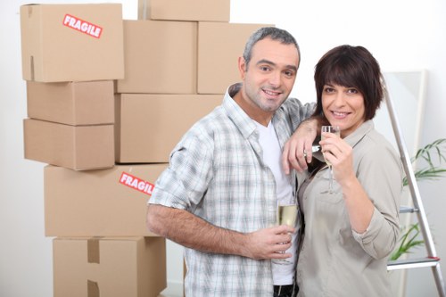 Packed household boxes and furniture loaded for transport